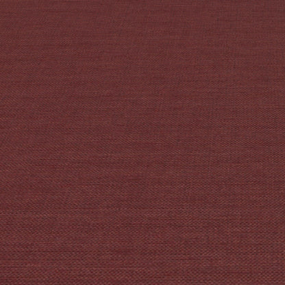 Rust-red jute-textured wallpaper close-up with visible fibers and subtle woven pattern.