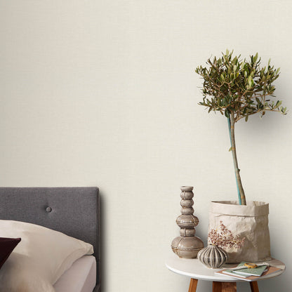 Cream wallpaper with a textured jute look and an abstract traditional pattern.