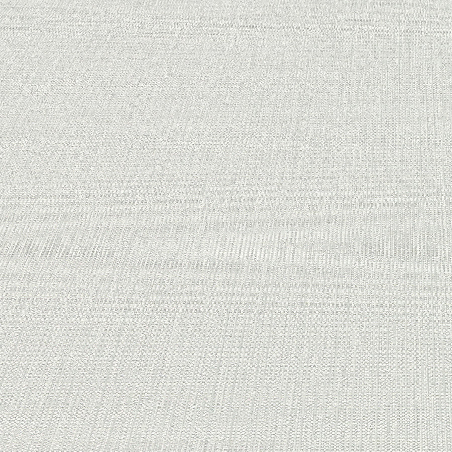 Light gray wallpaper with a subtle linear pattern.