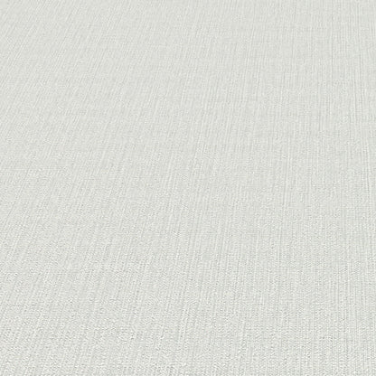 Light gray wallpaper with a subtle linear pattern.
