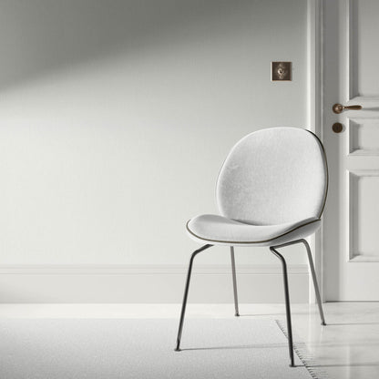 Light gray wallpaper with a subtle stria texture and an abstract traditional gray design.