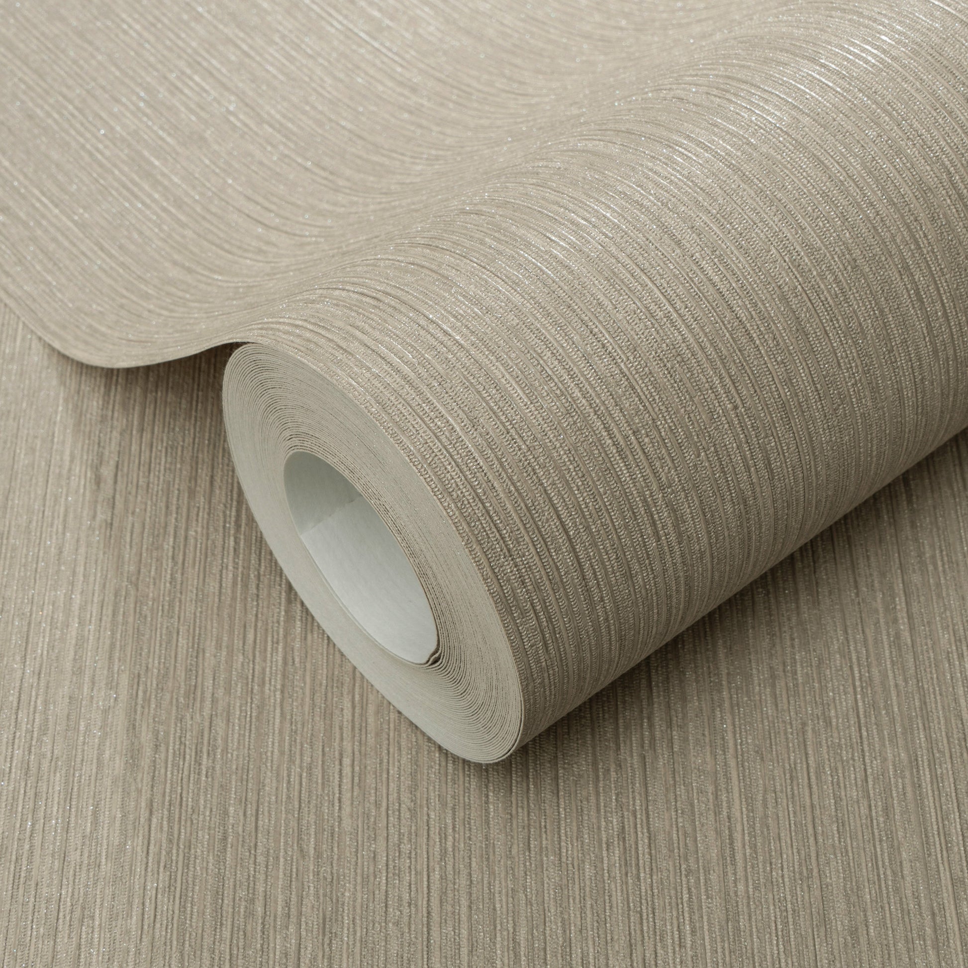 Beige textured wallpaper roll with subtle horizontal lines, partially unrolled to reveal paper core.