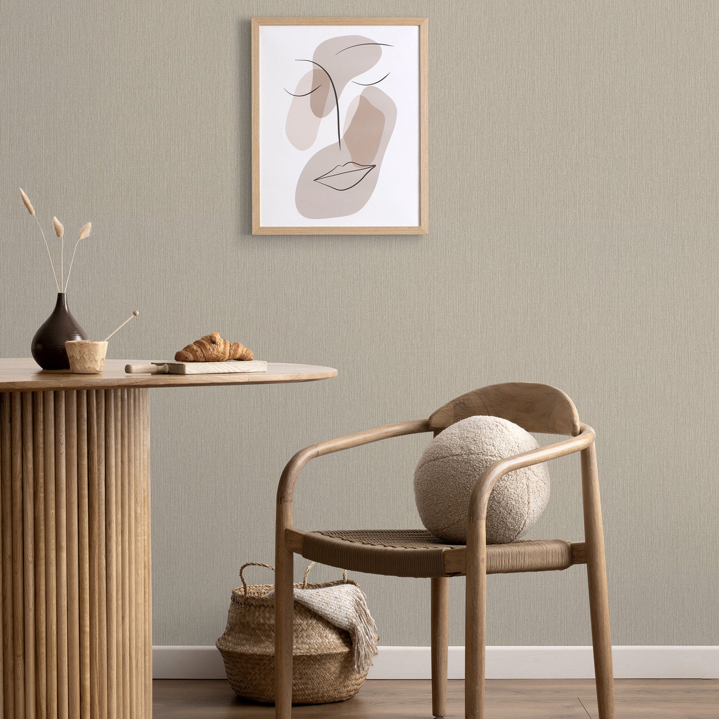Taupe wallpaper featuring a subtle loom-stria texture and abstract traditional pattern.