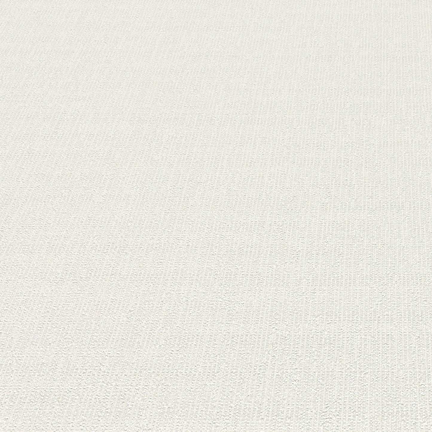 White wallpaper close-up showing a subtle textured loom-stria weave.