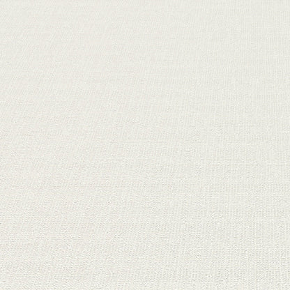 White wallpaper close-up showing a subtle textured loom-stria weave.