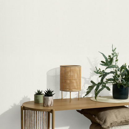 White wallpaper with a soft loom-stria texture and an abstract traditional pattern.