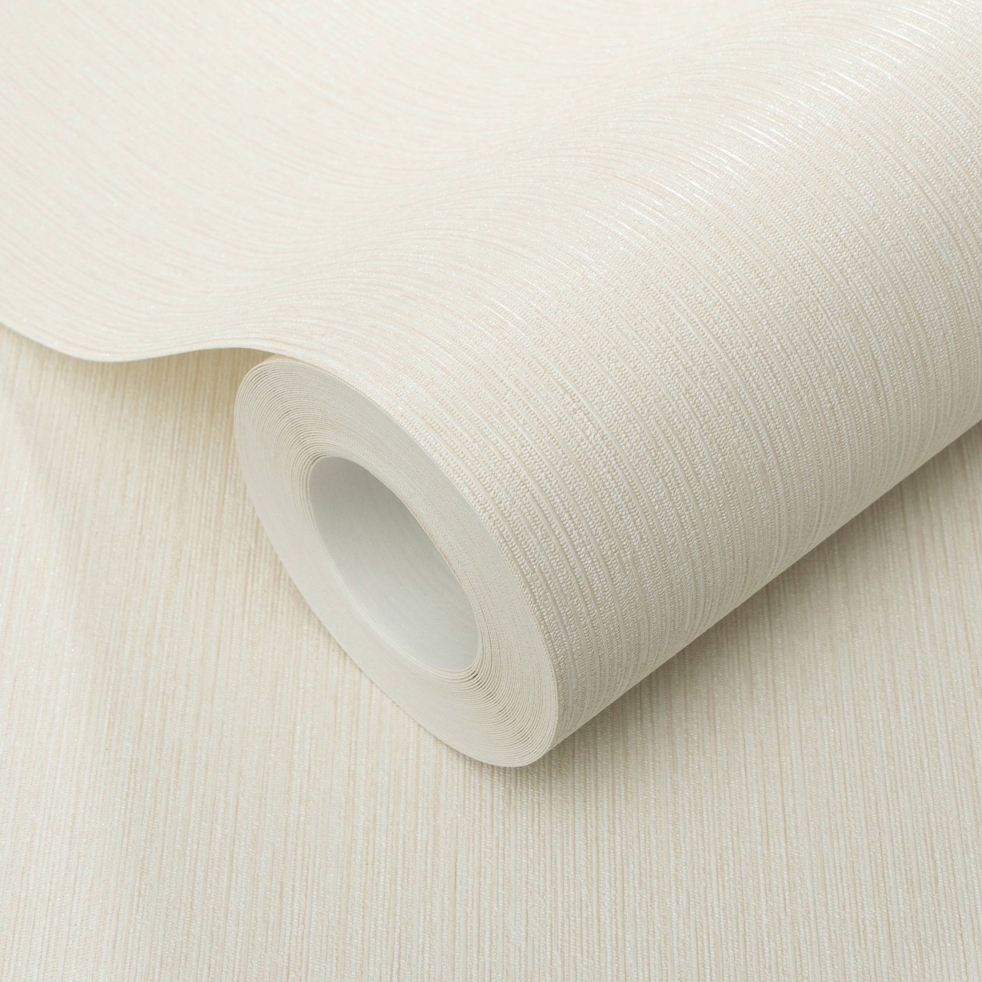 Cream textured wallpaper roll with subtle vertical grain, slightly unrolled for wall decor.