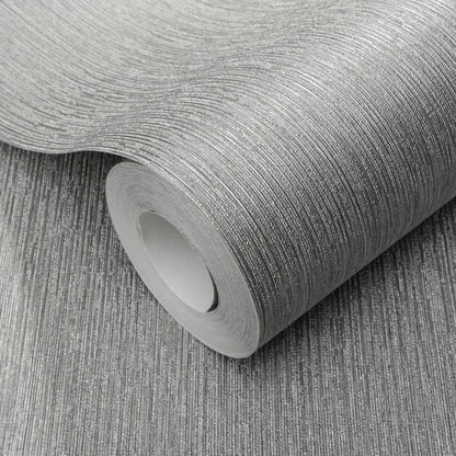 Roll of silver textured wallpaper with fine linear pattern and metallic sheen.