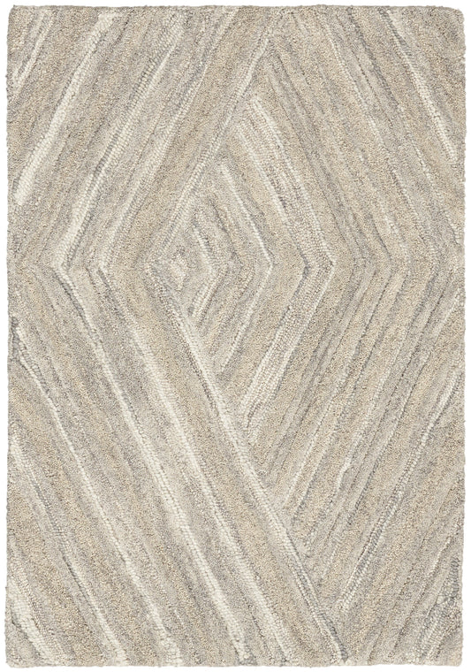 Beige and cream geometric shag rug with chevron/diamond pattern, soft textured pile, neutral tones.