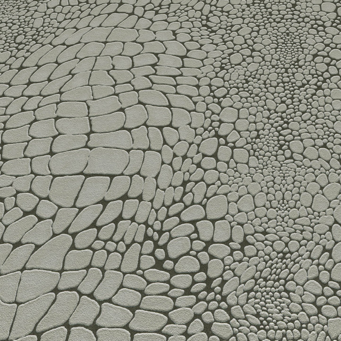 Gray cobblestone pavement with irregular rounded stones in varied sizes.