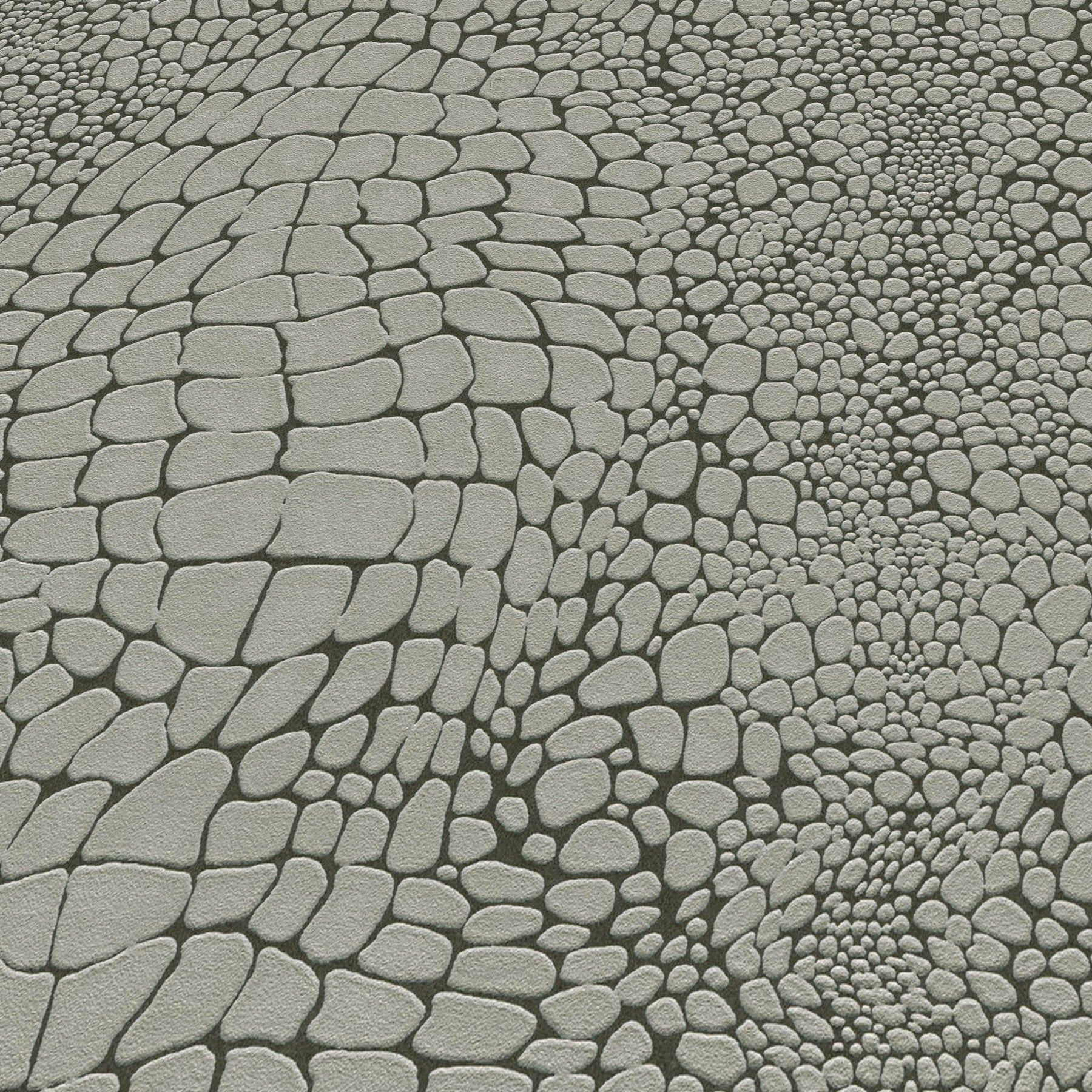 Gray cobblestone pavement with irregular rounded stones in varied sizes.