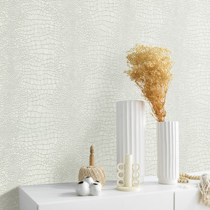 White ribbed ceramic vases with dried beige bouquet on a white tabletop, set against pale textured wallpaper.