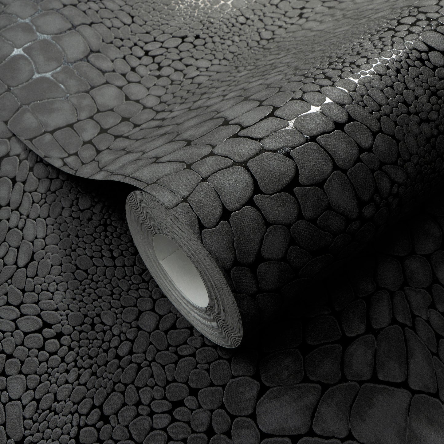Gray pebble-textured wallpaper roll with faux-stone pattern, rolled edge, ideal for accent walls.