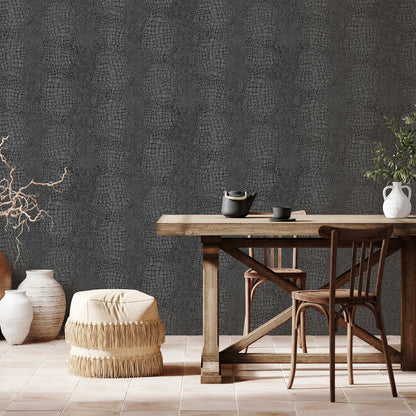 Close-up of black crocodile-skin wallpaper pattern.