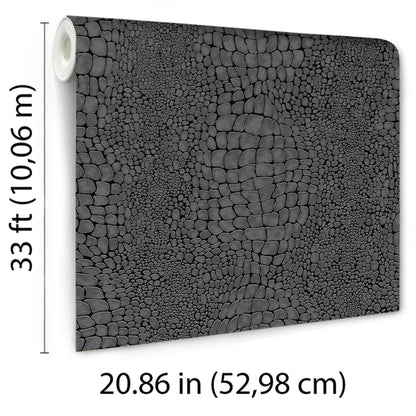 Rolled crocodile-skin textured black wallpaper; dark reptile pattern for modern decor.