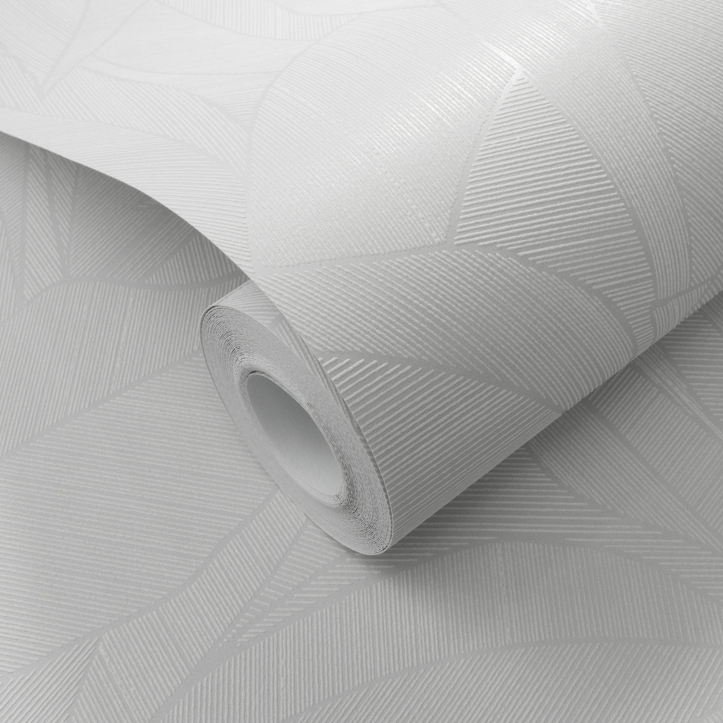 White wallpaper roll with a leaf pattern; rolled for wall decor.