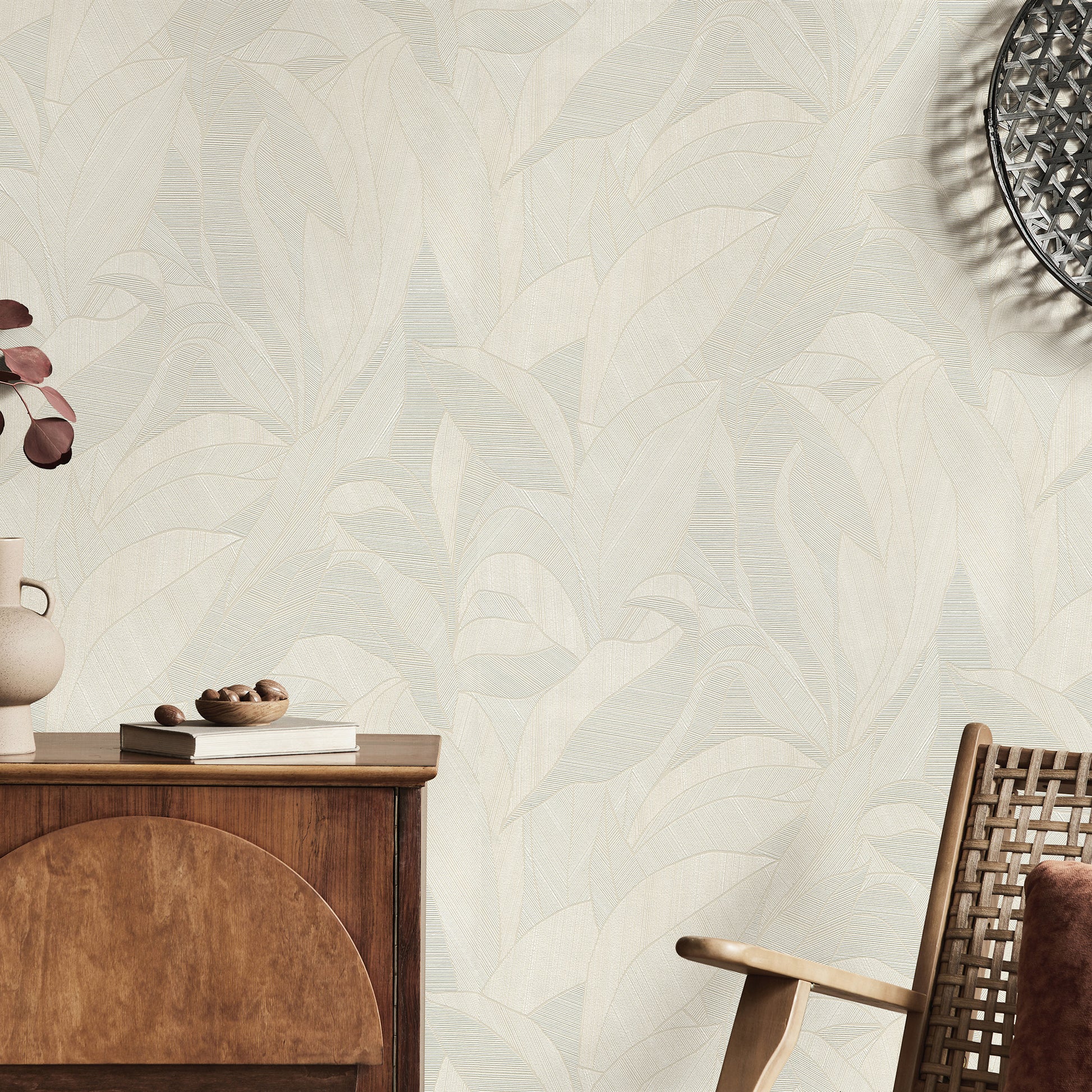 Beige wallpaper featuring a leafy pattern.