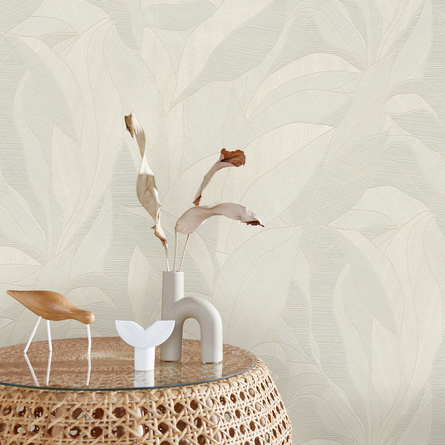 Beige wallpaper with a leaf motif.