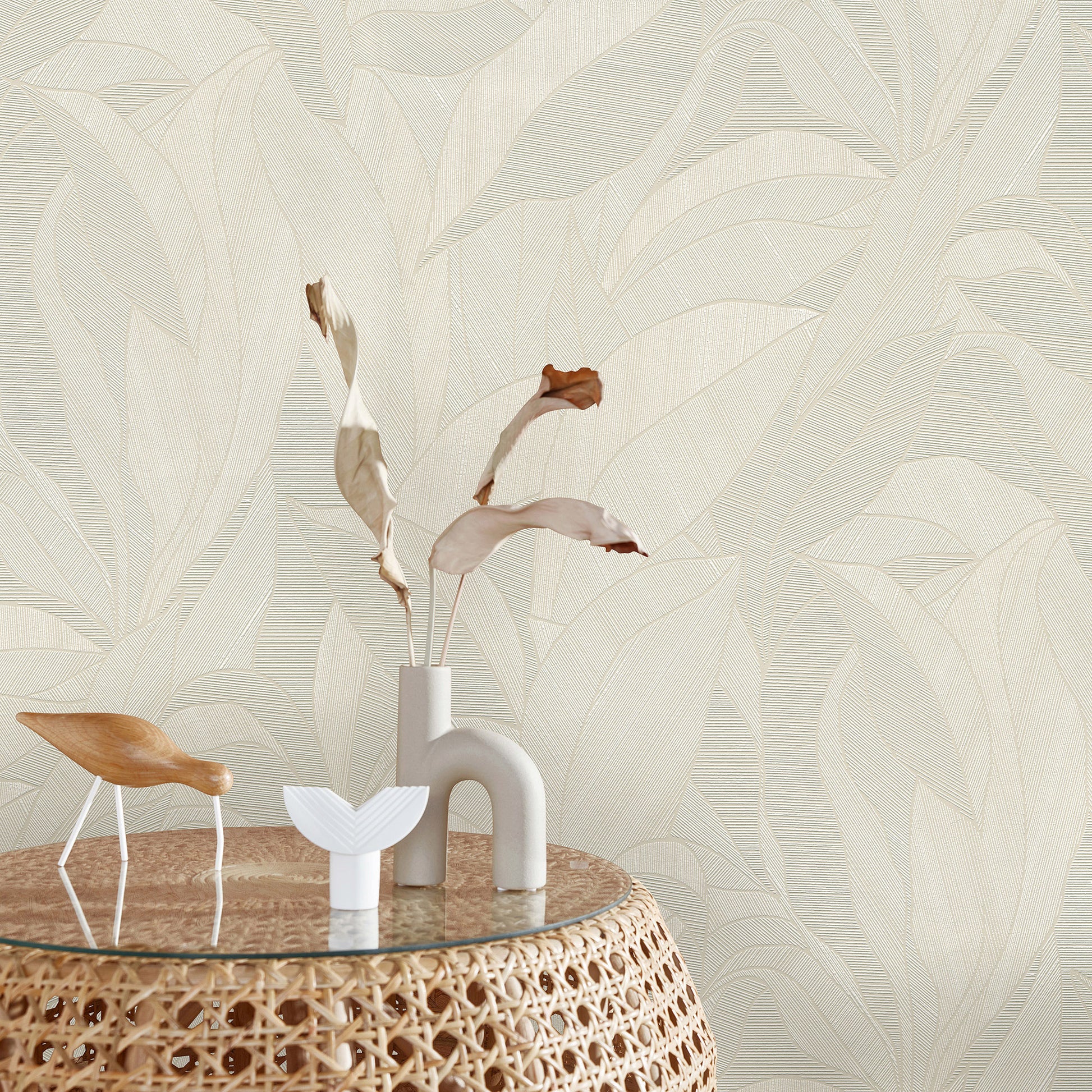 Beige wallpaper with a leaf motif.