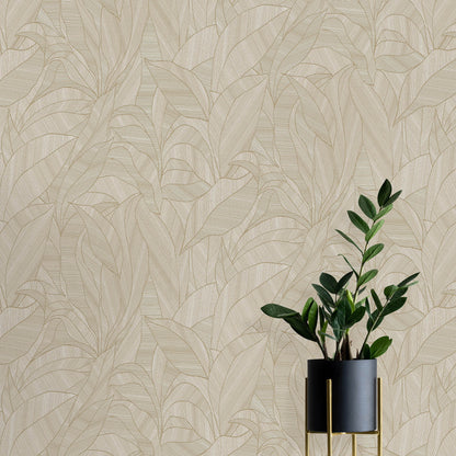 Beige tropical leaf wallpaper backdrop with a dark gray planter featuring gold accents and a tall glossy green plant.