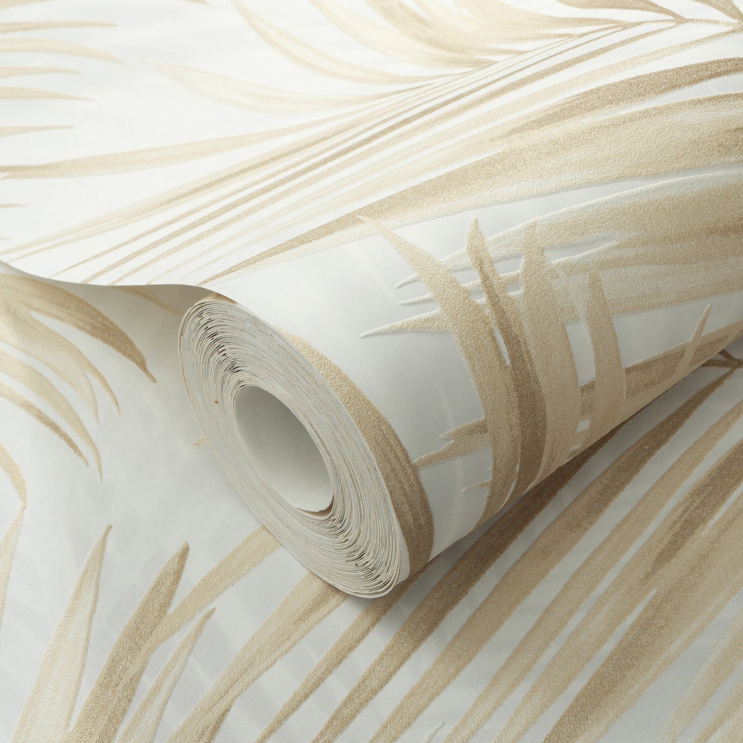 Rolled wallpaper with beige palm-leaf pattern on cream background; tropical botanical wallpaper for walls.