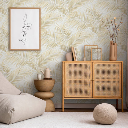Boho living room with a wooden rattan cabinet, cane-front doors, palm wallpaper, beige bean bag & framed line art.