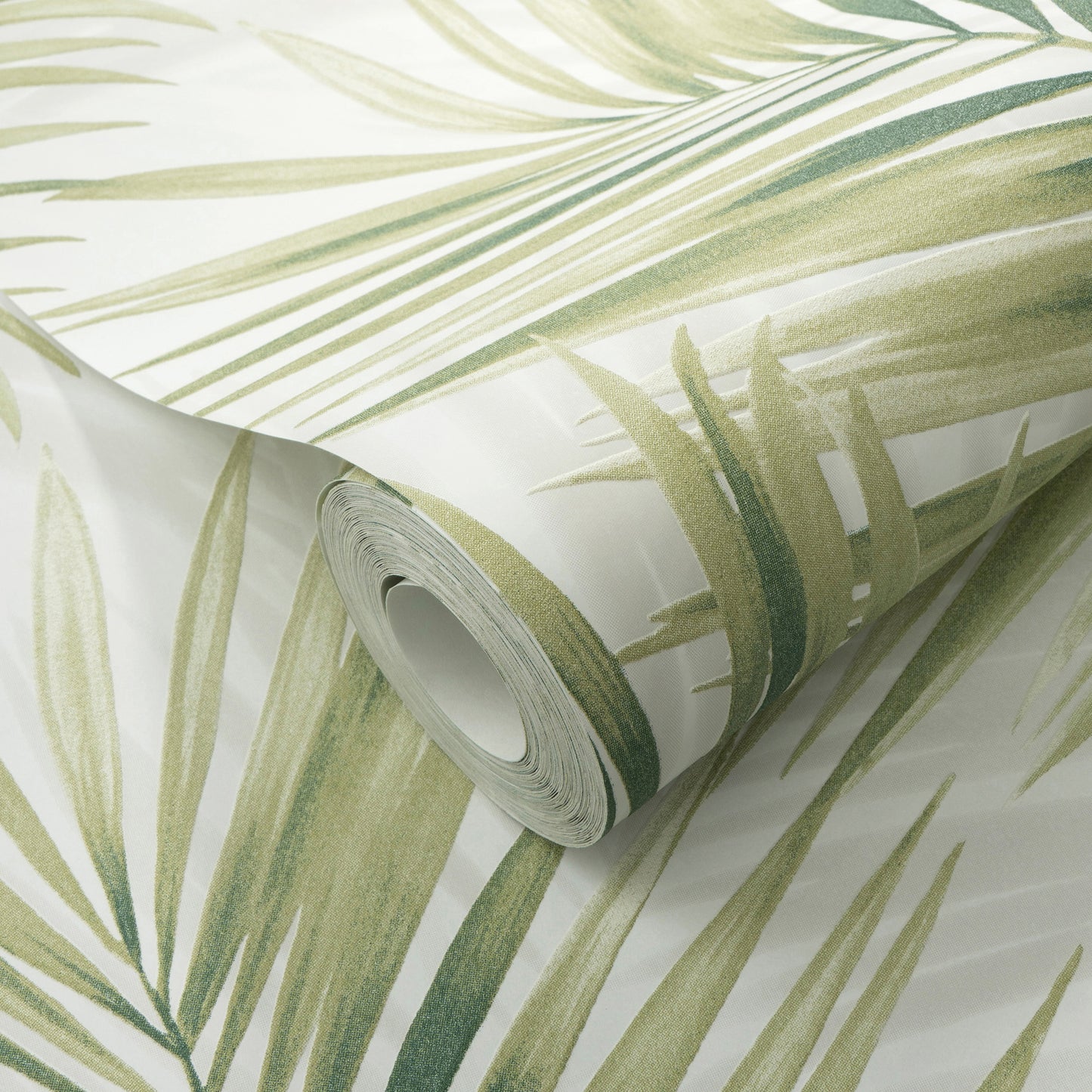 Rolled wallpaper featuring pale green tropical palm leaf design on white background.