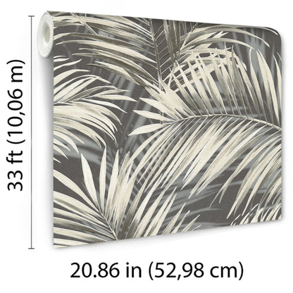 Rolled wallpaper panel with black palm fronds on charcoal gray background & tropical botanical print for walls.