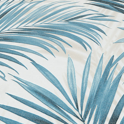 Blue-teal palm frond print on cream wallpaper; tropical botanical style.