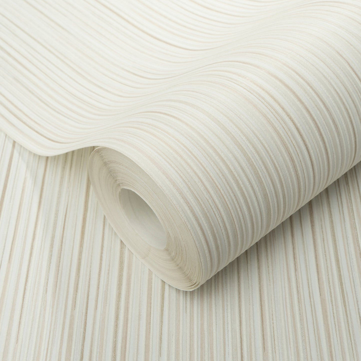 Cream striped wallpaper roll with subtle beige lines, rolled up to show curved edge and layered texture.