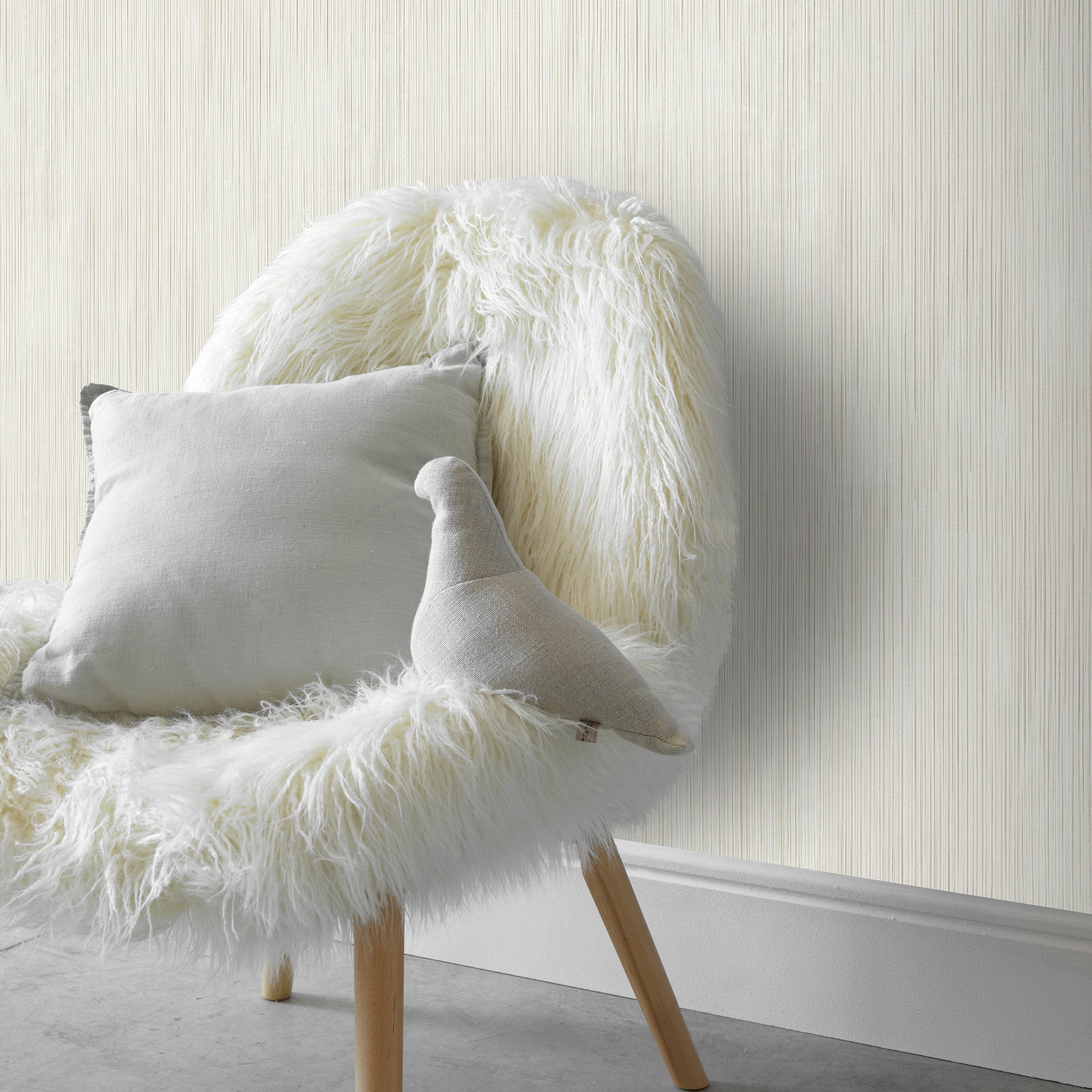 Beige wallpaper with a raised striped texture.