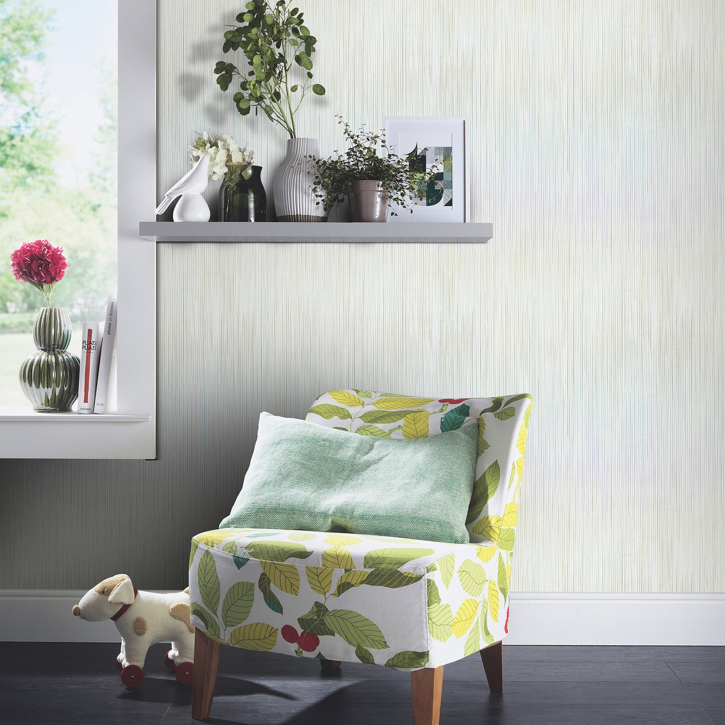Green wallpaper with a raised-stria pattern on a bright corner wall.