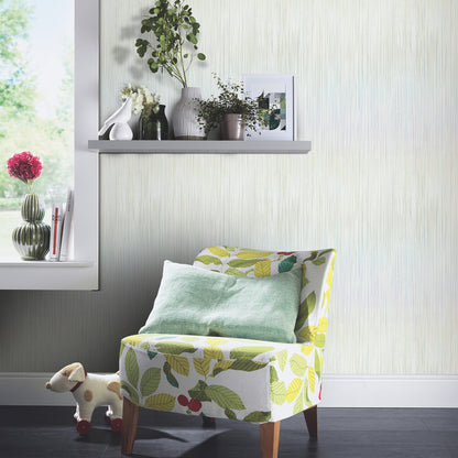 Green wallpaper with a raised-stria pattern on a bright corner wall.