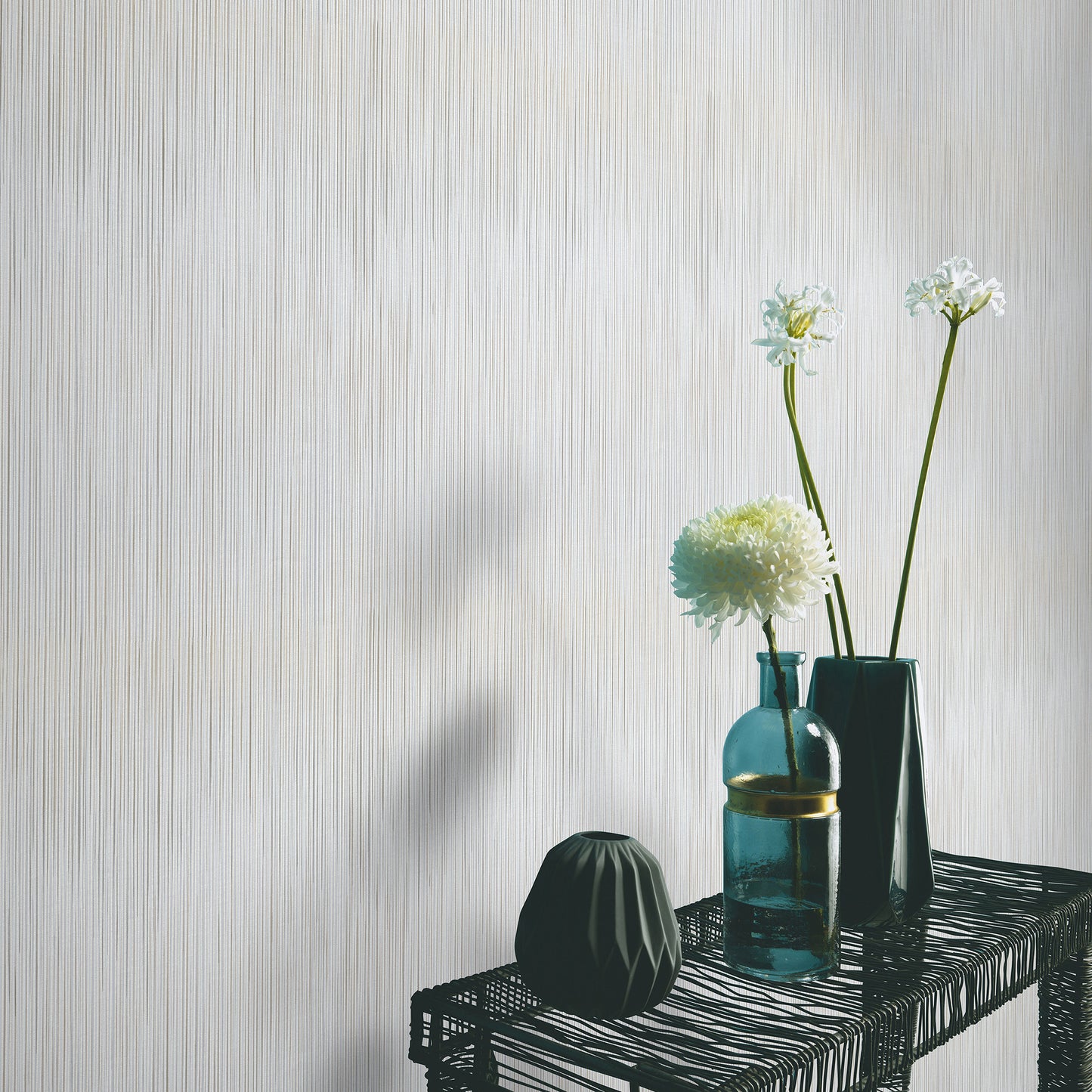 Close-up of taupe wallpaper featuring a raised stria texture in a traditional taupe pattern.