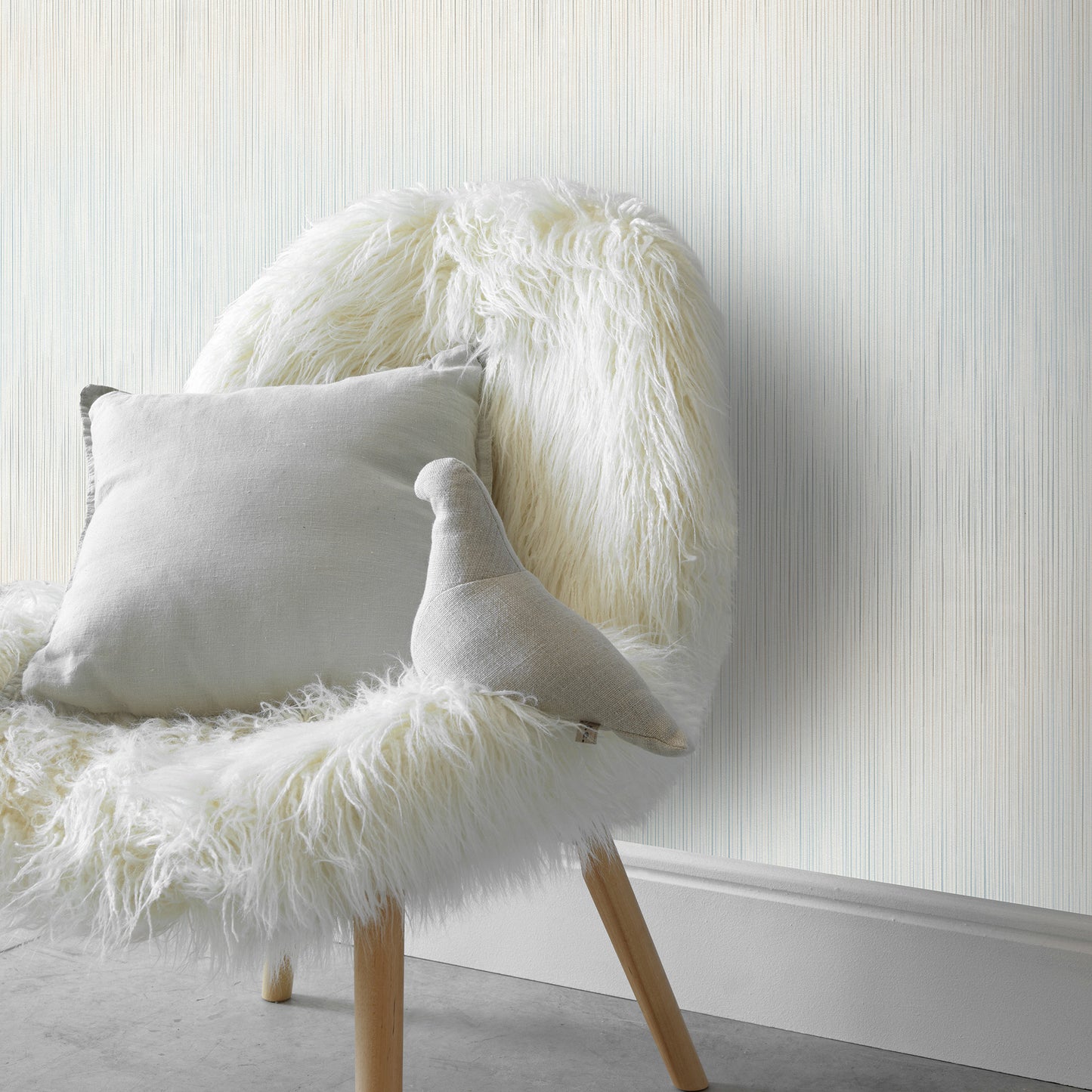 Blue wallpaper with a traditional pattern and subtle raised texture.