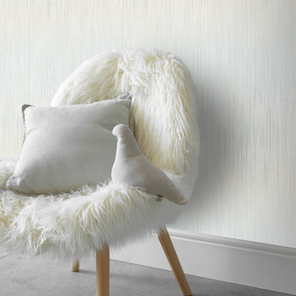 Blue wallpaper with a traditional pattern and subtle raised texture.