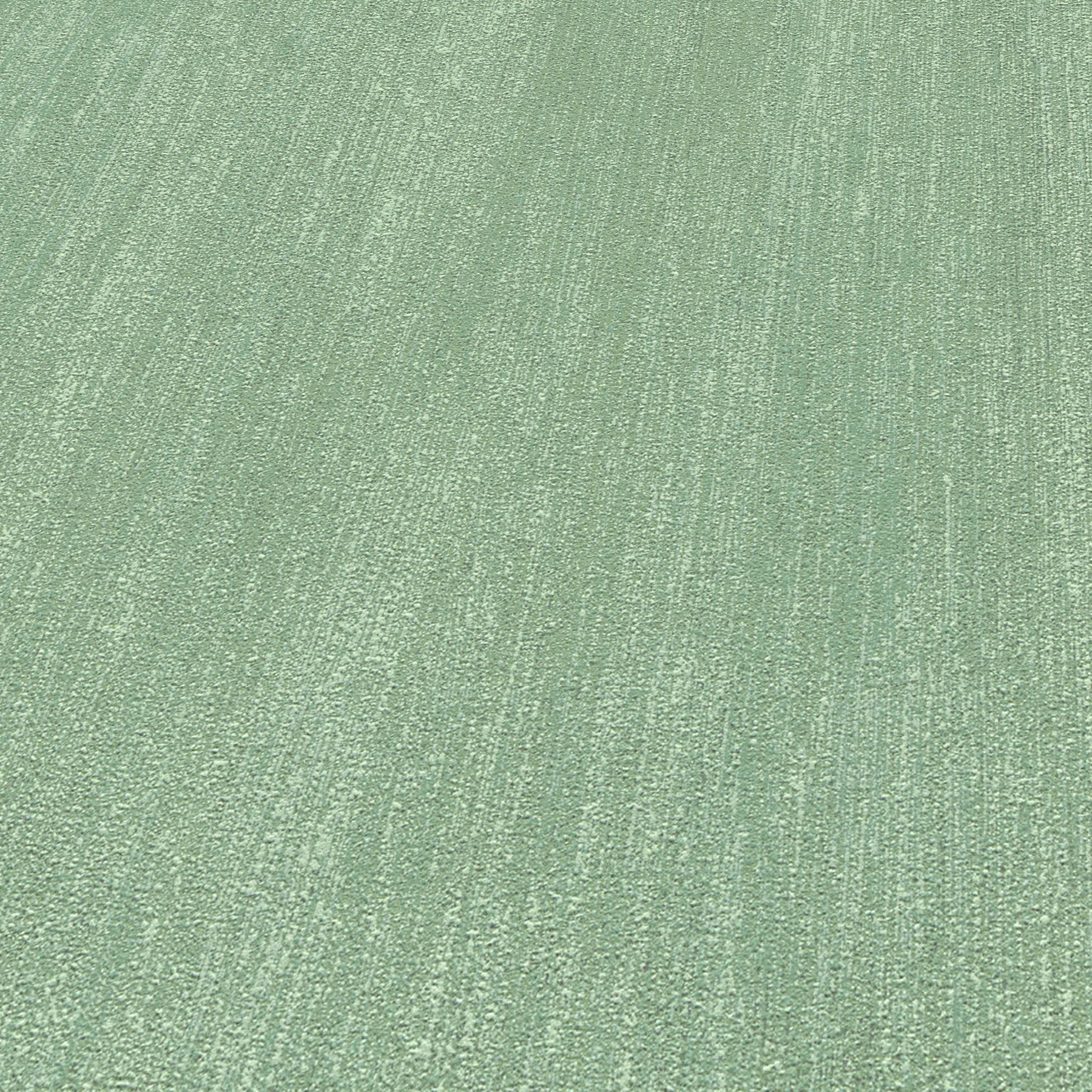 Close-up of light green textured wallpaper with a subtle raised linear weave.