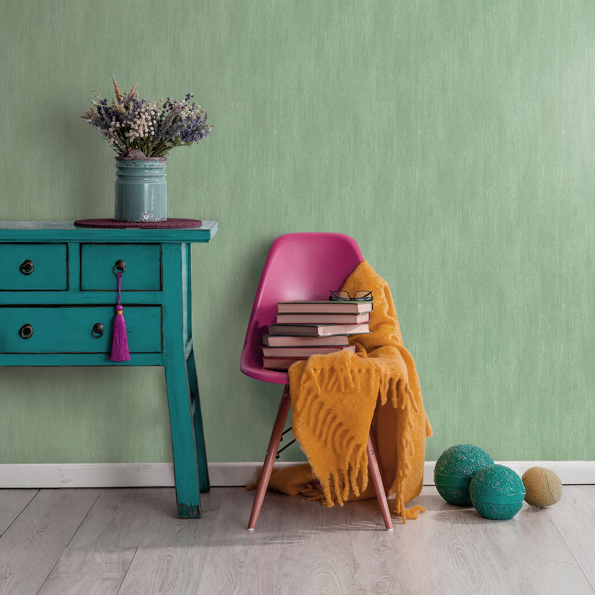 Traditional green wallpaper with raised texture pattern.