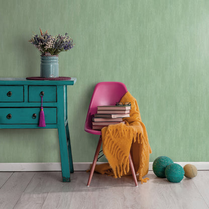 Traditional green wallpaper with raised texture pattern.