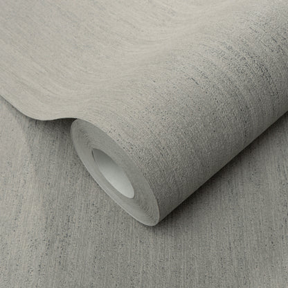 Taupe raised-texture wallpaper roll with subtle linen-like pattern, partially unrolled.
