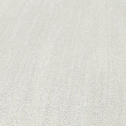 Cream off-white wallpaper with a raised texture pattern.
