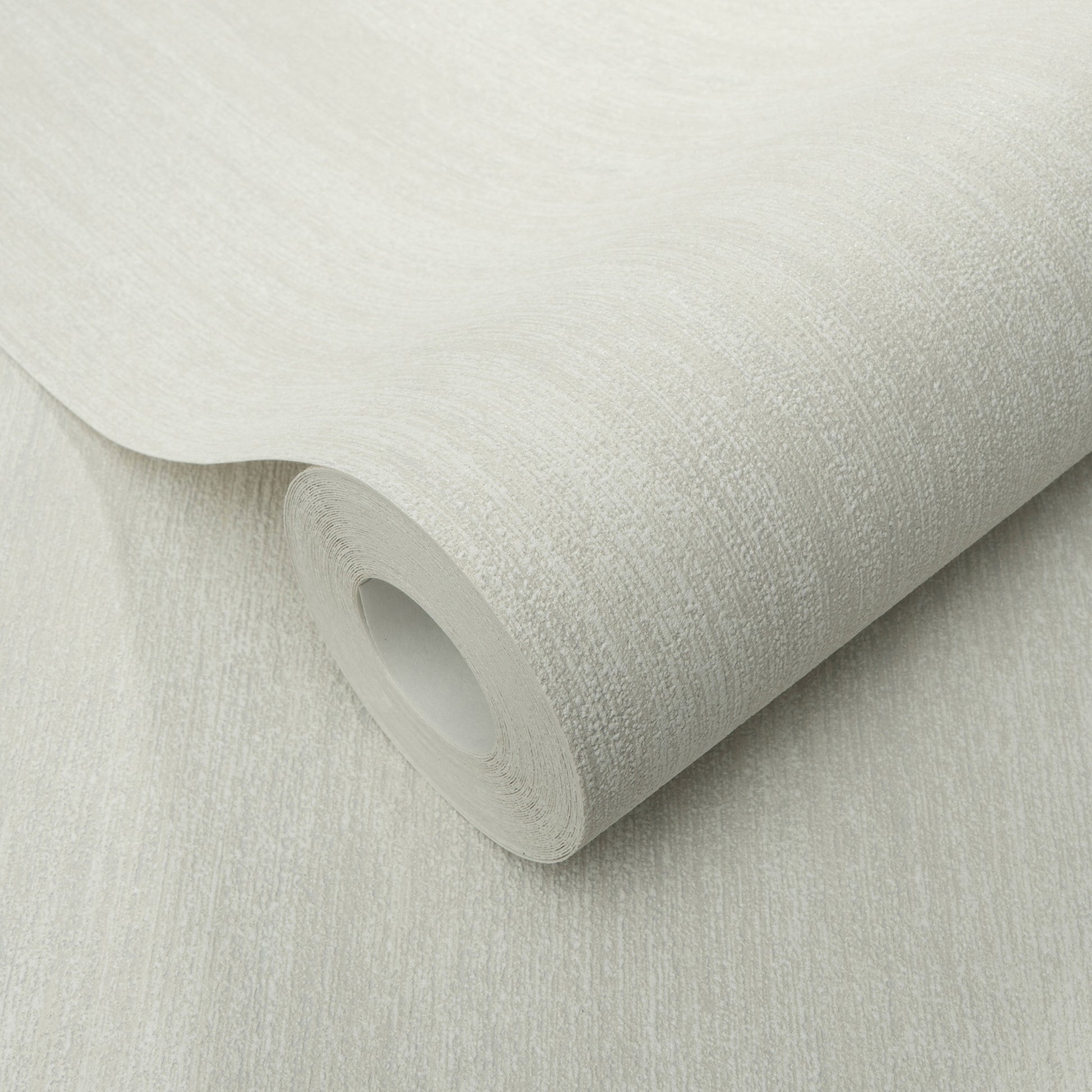 Cream textured wallpaper roll with subtle linen-like grain, rolled edge for interior decor.