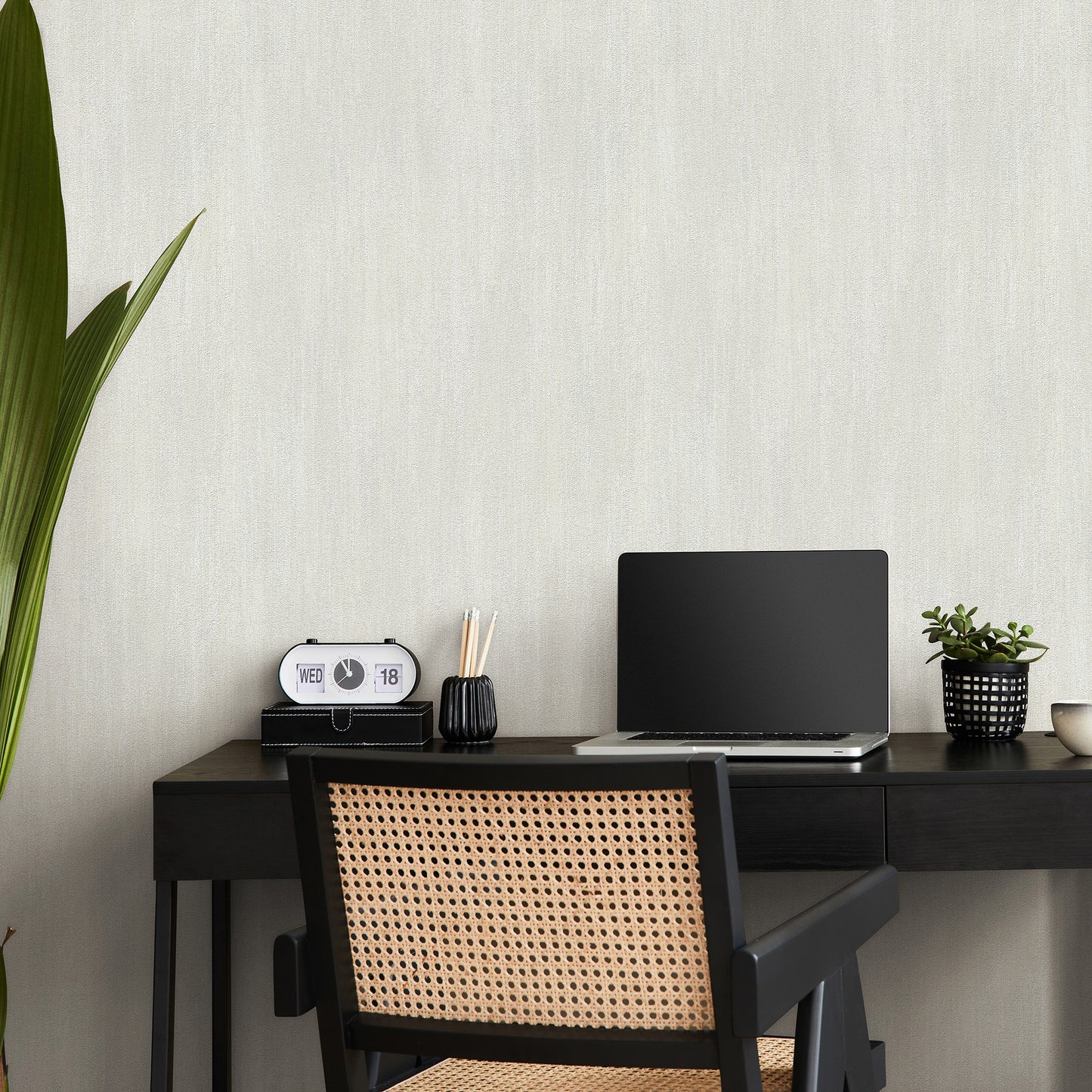 Off-white raised-texture wallpaper with a traditional pattern.