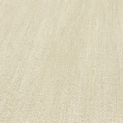 Beige textured wallpaper close-up with a raised pattern.