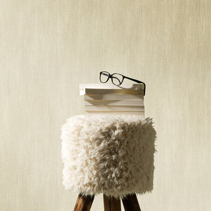 Beige raised-texture wallpaper with a traditional pattern.