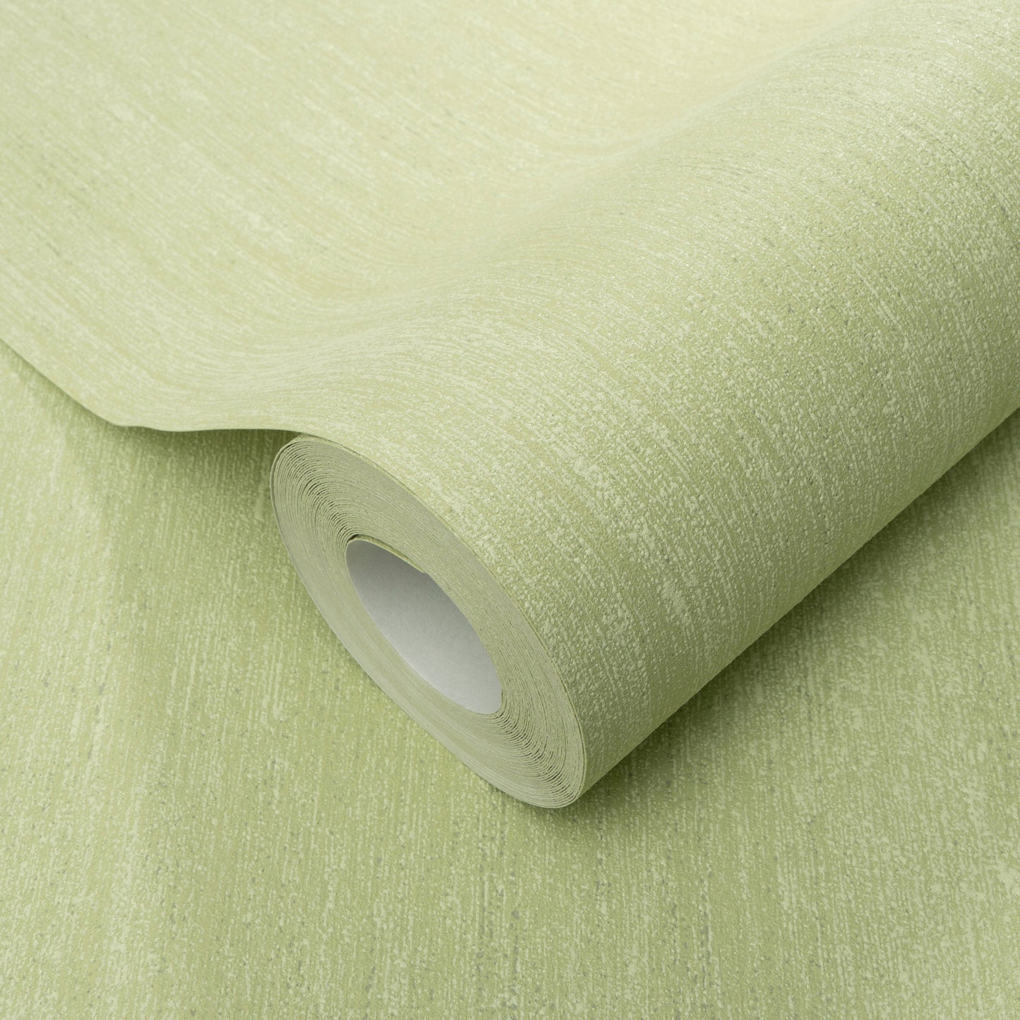 Light sage-green textured wallpaper roll with a brushed pattern, rolled around a white core.