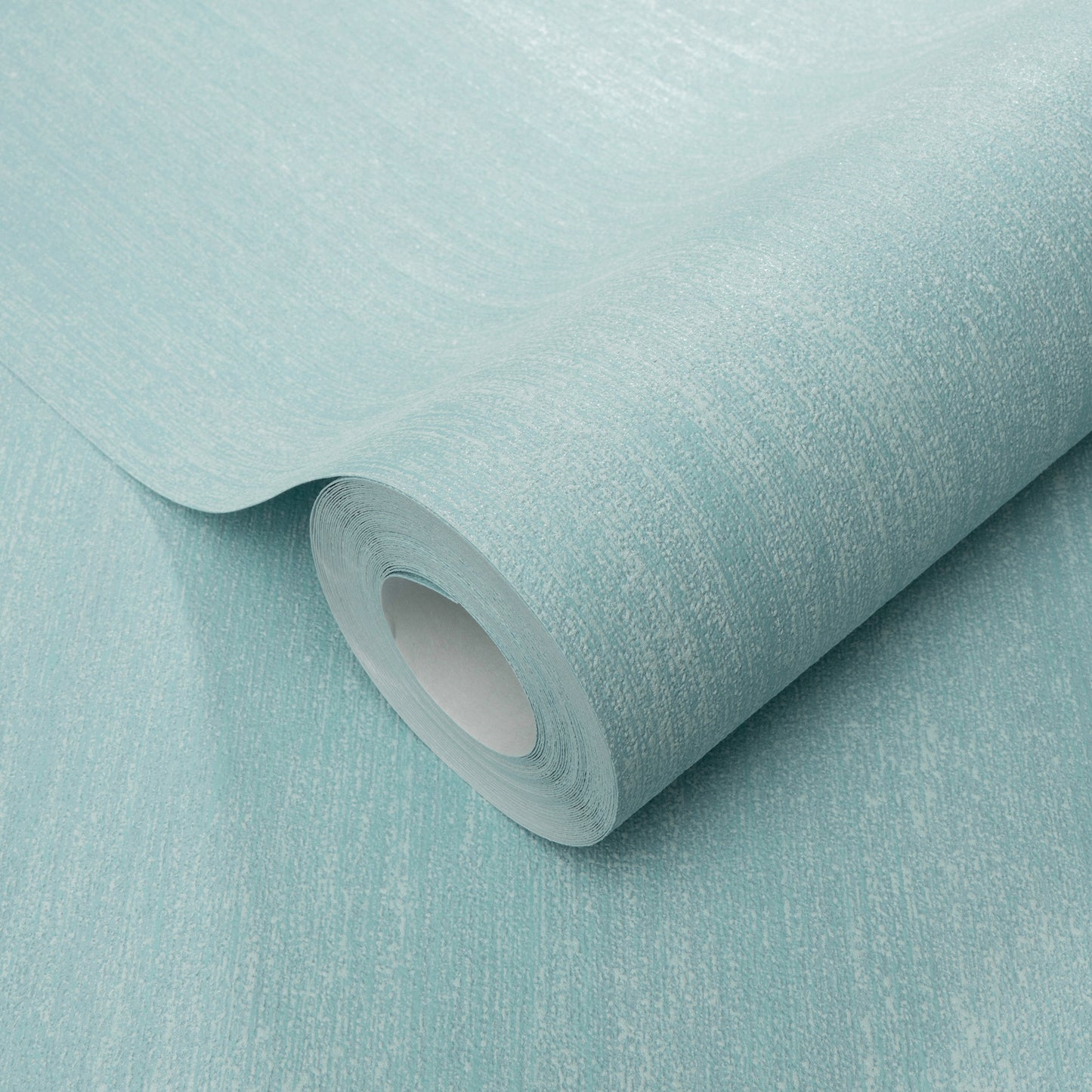Seafoam blue wallpaper roll with raised texture, partially unrolled showing the core