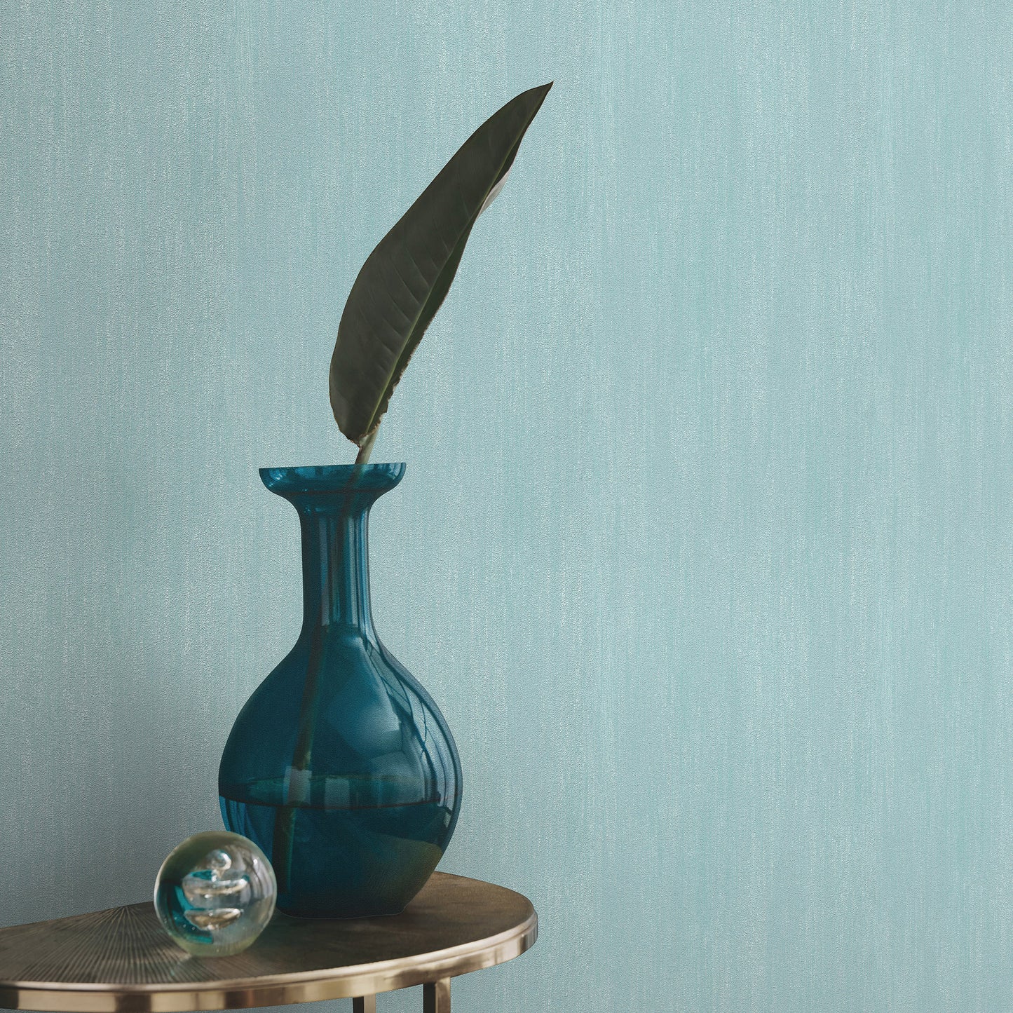 Blue raised-texture wallpaper with a traditional pattern.