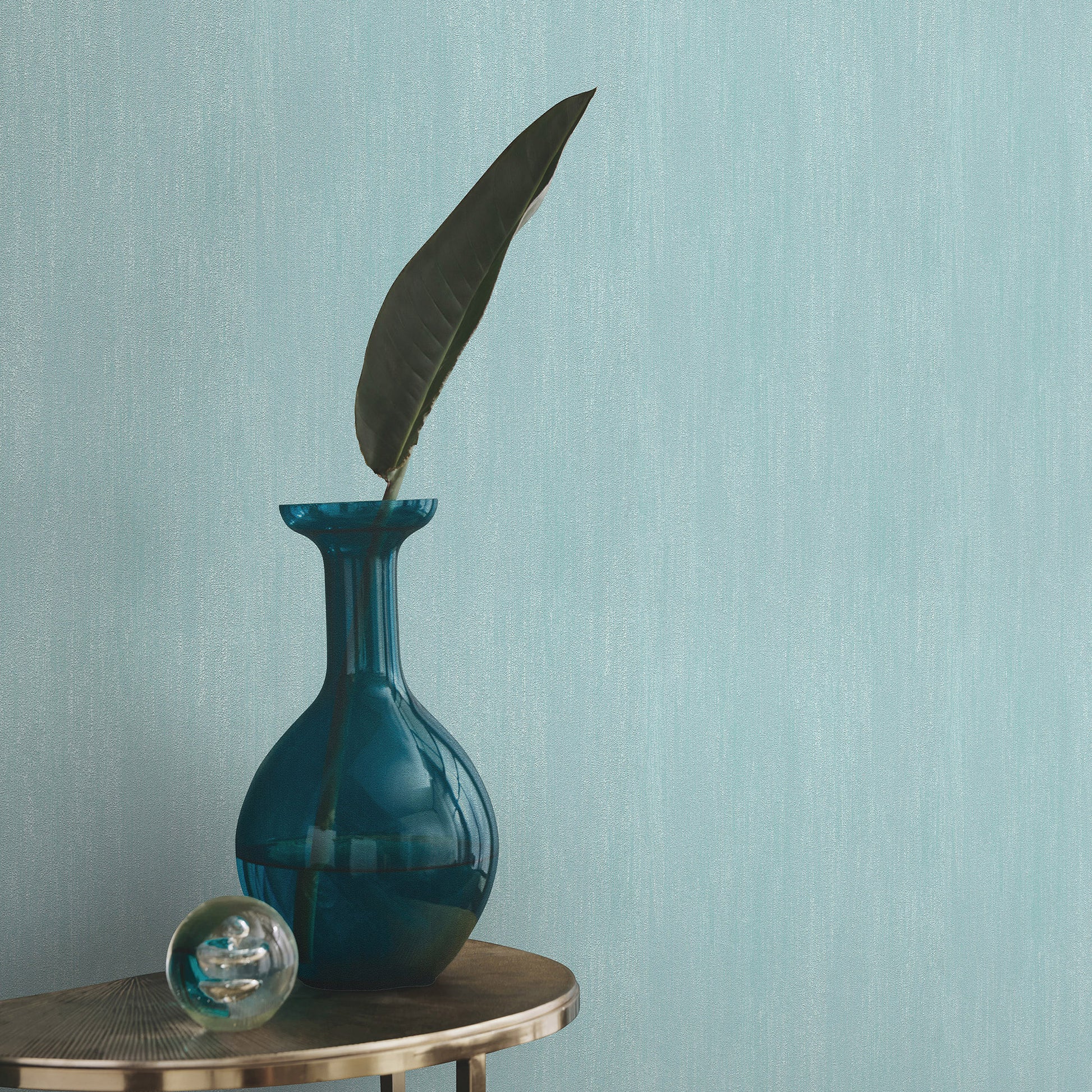 Blue raised-texture wallpaper with a traditional pattern.