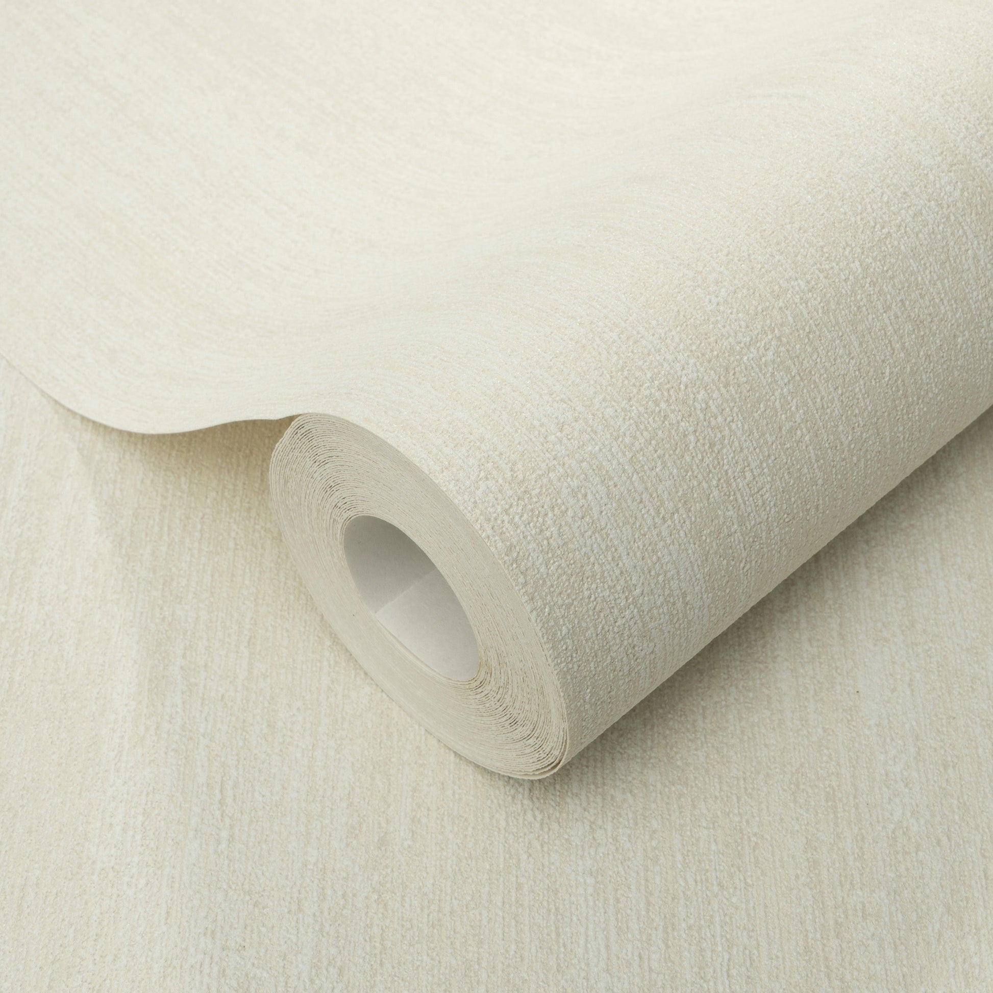 Cream textured wallpaper roll with linen-like weave and cardboard core.